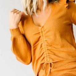 Piper & Scoot Tops The Charlie Cinched Ruffle Sweater In Rust