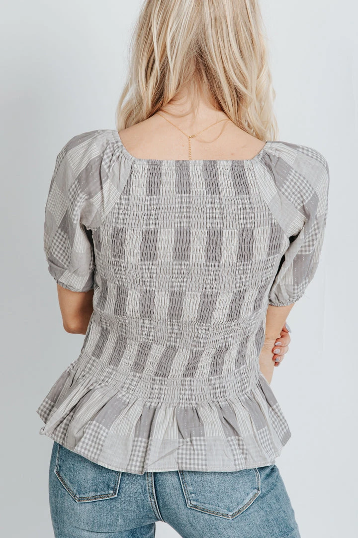 Piper & Scoot The Marylin Smocked Peplum In Grey Tops