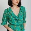 Piper & Scoot The Rustin Floral Ruffle Detail Blouse In Green Tops